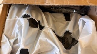 An inflatable PlungIT tub unpacked in its shipping box during the first small-volume order.