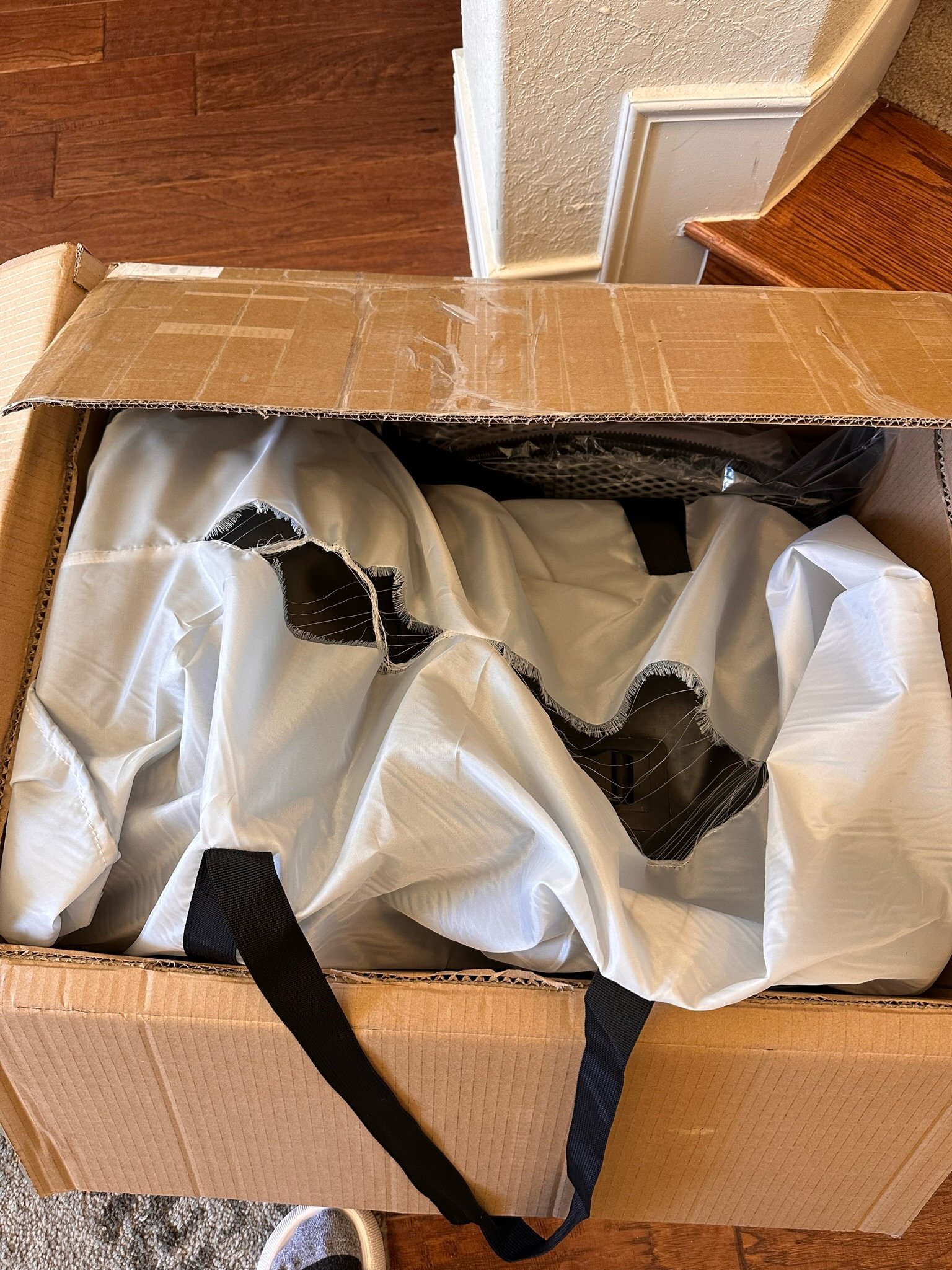 An inflatable PlungIT tub unpacked in its shipping box during the first small-volume order.