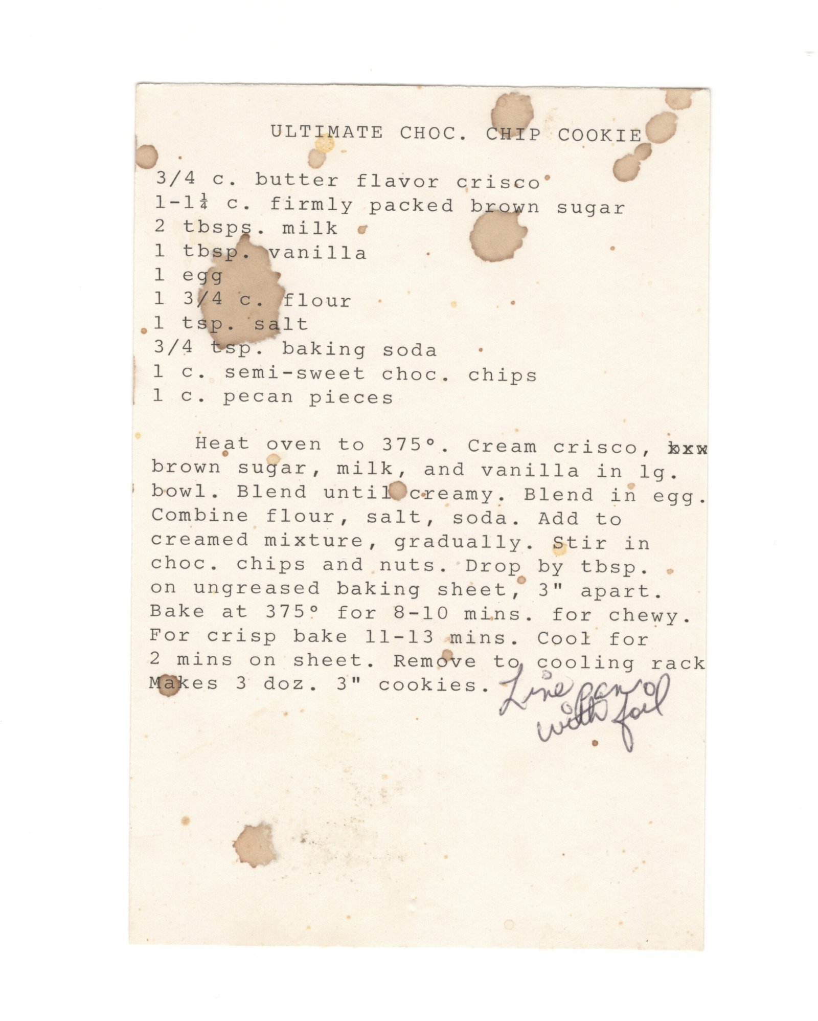 Original typewritten Ultimate Choc. Chip Cookie recipe card with stains and a handwritten note.